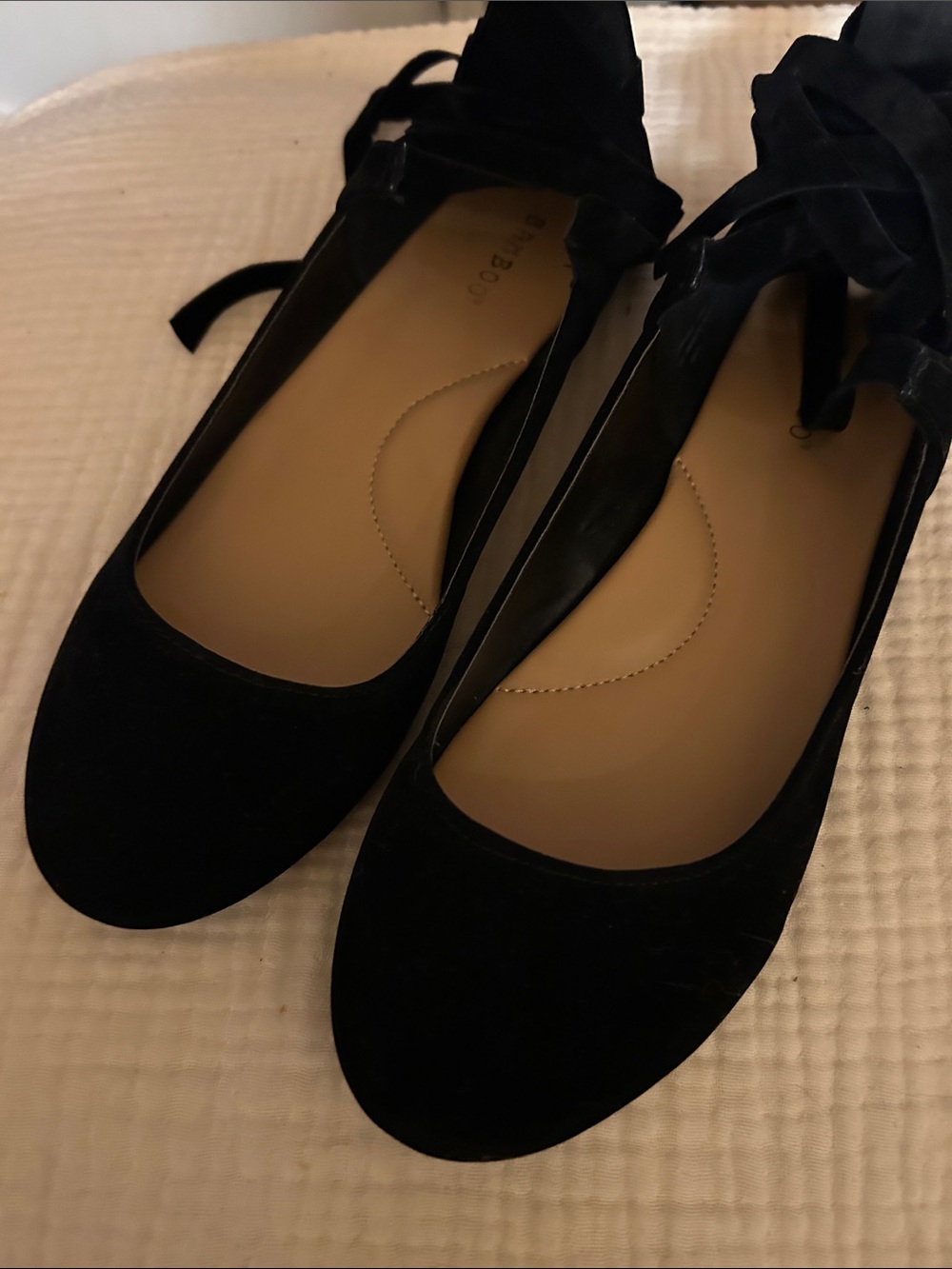 Ballet shoes with black ribbon